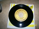 rear elvis presley45record that's all right w/punchmark