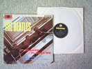 THE BEATLES Album Please Please Me with 13 other songs.