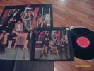 moby grape with poster & both have finger flipping you off
