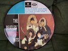 THE BEATLES HOTTEST HITS, PICTURE DISC, MINT CONDITION,12 TRACKS.