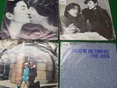 4 John lennon 45 rpm records. Woman,Watching the weels,Just like starting over