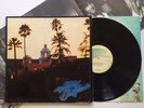 THE EAGLES - HOTEL CALIFORNIA - VINYL LP ALBUM + POSTER 7E-1084 STERLING LH (NM)