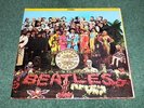 THE BEATLES - SGT. PEPPER’S LONELY HEARTS CLUB BAND CANADA GREY/PINK SWIRL