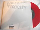 SYSTEM OF A DOWN   TOXICITY ** 2002 COLUMBIA 45. RED VINYL. MINT