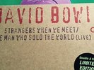 DAVID BOWIE STRANGERS WHEN WE MEET/THE MAN WHO SOLD THE WORLD GREEN VINYL 7-INCH