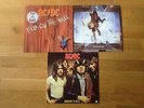 AC/DC. Three albums.Highway to hell.Blow up your video.Fly on the wall.