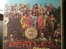 Sgt. Pepper's Lonely Hearts Club Band by the Beatles (Vinyl 1967) with cut out