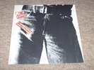 THE ROLLING STONES , STICKY FINGERS . LARGE ZIPPER . LISTEN TO BOTH SIDES .
