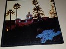 EAGLES - HOTEL CALIFORNIA LP RECORD EX VINYL W/ POSTER 1976 7E 1084