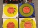 U2 4PLAY RARE YELLOW VINYL 4 PACK 7’’ SINGLE SET IN WALLET. EXCELLENT CONDITION.
