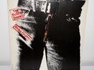 The ROLLING STONES. STICKY FINGERS L. P.  with the famous zipper cover See more
