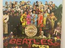 Beatles - SGT Peppers Lonely Hearts Club Band -Vinyl Lp with cut out card.