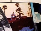 EX NM 1976 orig EAGLES HOTEL CALIFORNIA lp w POSTER inner 7E STERLING plays EX
