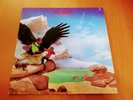 BUDGIE - NEVER TURN YOUR BACK ON A FRIEND. VINYL LP.   MCA.  1974 REISSUE.