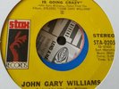 John Gary Williams. The whole damn world is going  crazy
