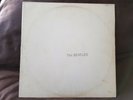 The Beatles Whte LP # SWBO 101 is in Excellent  condition The jacket is worn.