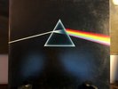 1973 Pink Floyd “Dark Side Of The Moon” vinyl record w/ poster & stickers
