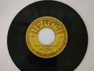 1955 Sun 217 45 record. Elvis Presley, Baby, let's Play House. Plays,punch marks