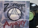 Zoetrope ‎– Amnesty LP 1985 Combat ‎– MX 8025 VG+/VG+