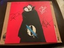 Signed ‘... Like Clockwork’ by Queens of the Stone Age. 