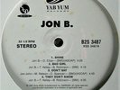 JON B. 