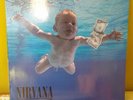 Nevermind-Nirvana-1991 Europe misprint with embossed clef-original printed inner