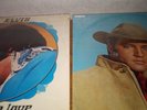Two Elvis Presley records sealed.Flaming Star and almost in love.