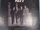 Vinyl Record of KISS Dressed to Kill in good condition shelf wear to sleeve