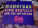 Elvis Costello & The Imposters- Momofuku-2x 12