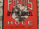 SCRAPING FOETUS OFF THE WHEEL HOLE 12