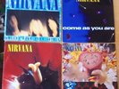FOUR NIRVANA 7 INCH VINYL SINGLES SMELLS LIKE TEEN SPIRIT IN BLOOM COME AS YOU