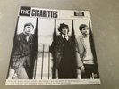 THE CIGARETTES RARE 7” THEY’RE BACK AGAIN, HERE THEY COME *RED LABEL 1ST PRESS*