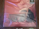 BAD OMENS THE DEATH OF PEACE OF MIND ORANGE SPLATTER VINYL IN HAND
