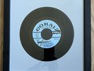 One (1) 45 rpm vinyl record frame With Blue Mat