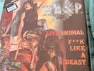 WASP  INCLUDES POSTER SLEEVE LIVE ANIMAL VINYL RECORD